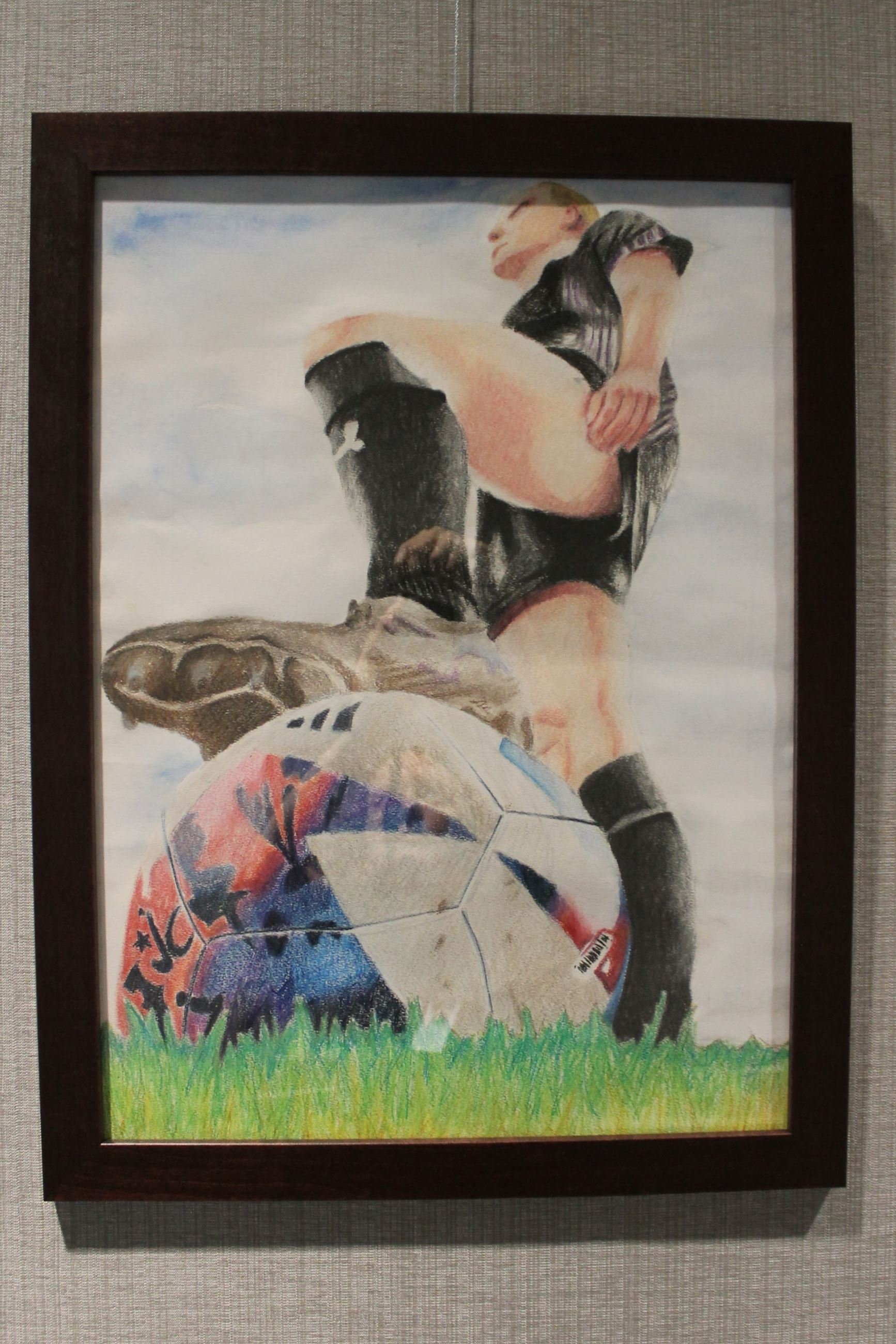 Picture of a drawing of a girl playing soccer 
