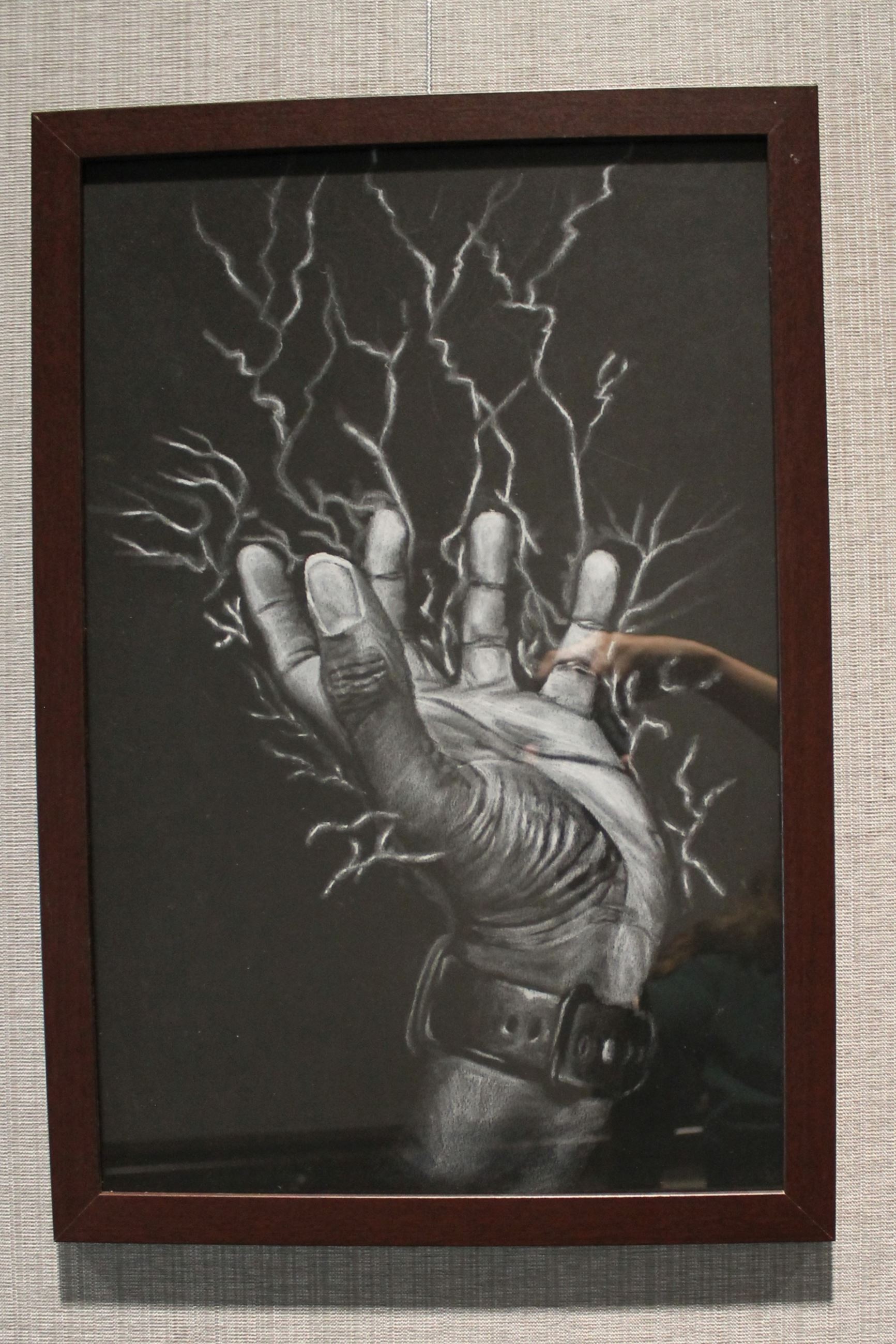 Picture of a drawing of a hand with electricity coming out of it