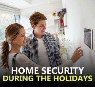 man and woman in font of a home security device